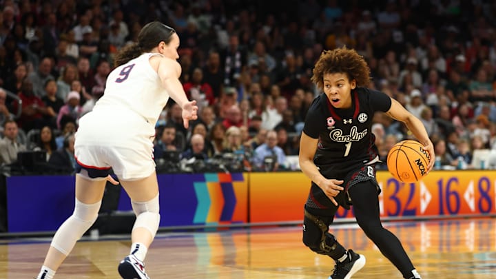 Apr 3, 2026; Phoenix, AZ, USA; UConn Huskies guard Kayleigh Heckel (9) defends against South Carolina Gamecocks guard Maddy McDaniel (1) during the first half of a semifinal of the Final Four of the women's 2026 NCAA Tournament at Mortgage Matchup Center. Mandatory Credit: Mark J. Rebilas-Imagn Images