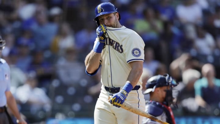 Seattle Mariners catcher Cal Raleigh (29) wipes his face as he walks to the dugout after striking out against the Minnesota Twins during the ninth inning at T-Mobile Park on June 30. Seattle Mariners catcher Cal Raleigh (29) wipes his face as he walks to the dugout after striking out against the Minnesota Twins during the ninth inning at T-Mobile Park on June 30.