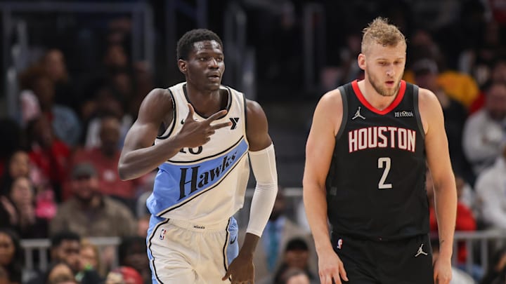 Jan 28, 2025; Atlanta, Georgia, USA; Atlanta Hawks forward Mouhamed Gueye (18) reacts after a three-pointer against the Houston Rockets in the fourth quarter at State Farm Arena. Mandatory Credit: Brett Davis-Imagn Images
