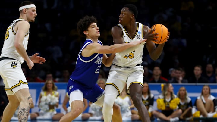 Mar 20, 2025; Wichita, KS, USA; Drake Bulldogs guard Isaia Howard (23) defends Missouri Tigers guard Mark Mitchell (25) in the second half of a first round men’s NCAA Tournament game at Intrust Bank Arena. Mandatory Credit: Nick Tre. Smith-Imagn Images Mar 20, 2025; Wichita, KS, USA; Drake Bulldogs guard Isaia Howard (23) defends Missouri Tigers guard Mark Mitchell (25) in the second half of a first round men’s NCAA Tournament game at Intrust Bank Arena. Mandatory Credit: Nick Tre. Smith-Imagn Images