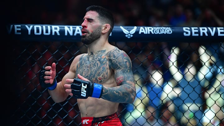 Feb 17, 2024; Anaheim, California, USA; Ilia Topuria reacts to his championship victory against Alexander Volkanovski during UFC 298 at Honda Center. Mandatory Credit: Gary A. Vasquez-Imagn Images