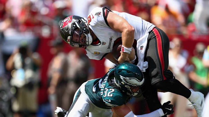 Sep 29, 2024; Tampa, Florida, USA; Tampa Bay Buccaneers quarterback Baker Mayfield (6) scores a touchdown past Philadelphia Eagles safety Reed Blankenship (32) in the second quarter at Raymond James Stadium. Mandatory Credit: Nathan Ray Seebeck-Imagn Images
