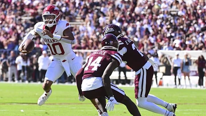 Oct 26, 2024; Starkville, Mississippi, USA; Arkansas Razorbacks quarterback Taylen Green (10) runs the ball against the Mississippi State Bulldogs during the first quarter at Davis Wade Stadium at Scott Field. Mandatory Credit: Matt Bush-Imagn Images
