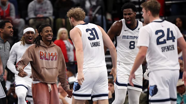 Nov 28, 2025; Inglewood, California, USA;  Memphis Grizzlies guard Ja Morant (left) and forward Jaren Jackson Jr. (8) greet center Jock Landale (31) during the fourth quarter against the Los Angeles Clippers at Intuit Dome. Mandatory Credit: Kiyoshi Mio-Imagn Images