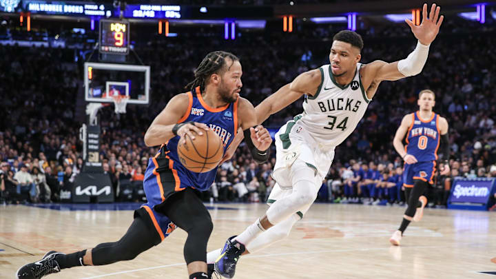 Dec 23, 2023; New York, New York, USA; New York Knicks guard Jalen Brunson (11) looks to drive past Milwaukee Bucks forward Giannis Antetokounmpo (34) in the second quarter at Madison Square Garden. Mandatory Credit: Wendell Cruz-Imagn Images