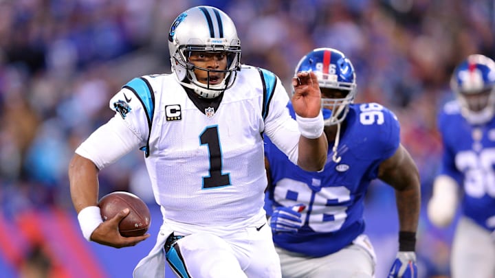 Dec 20, 2015; East Rutherford, NJ, USA; Carolina Panthers quarterback Cam Newton (1) runs with the ball against the New York Giants during the fourth quarter at MetLife Stadium. The Panthers defeated the Giants 38-35. Mandatory Credit: Brad Penner-Imagn Images