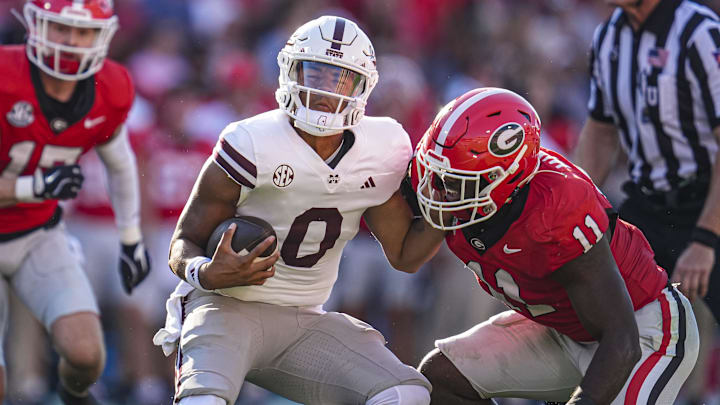 Oct 12, 2024; Athens, Georgia, USA; Mississippi State Bulldogs quarterback Michael Van Buren Jr. (0) is tackled by Georgia Bulldogs linebacker Jalon Walker (11) during the first half at Sanford Stadium. Mandatory Credit: Dale Zanine-Imagn Images