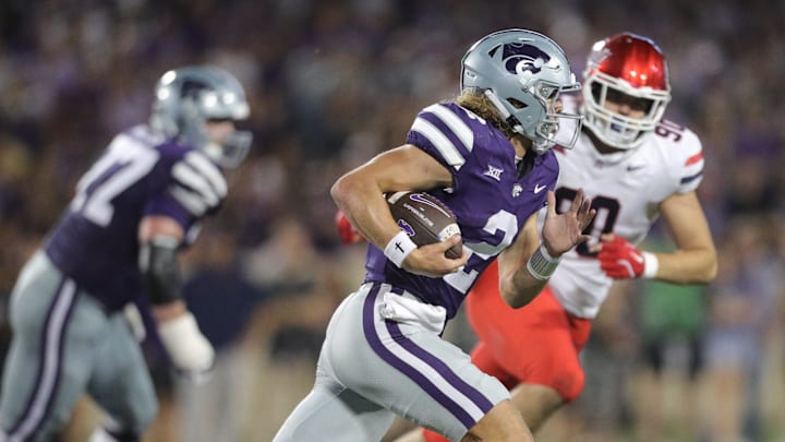 Kansas State Wildcats quarterback Avery Johnson (2) runs the ball during the third quarter of the game against Arizona at Bill Snyder Family Stadium on Friday, September 13, 2024. Kansas State Wildcats quarterback Avery Johnson (2) runs the ball during the third quarter of the game against Arizona at Bill Snyder Family Stadium on Friday, September 13, 2024.