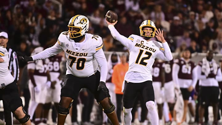 Nov 23, 2024; Starkville, Mississippi, USA; Missouri Tigers quarterback Brady Cook (12) throws against the Mississippi State Bulldogs during the third quarter at Davis Wade Stadium at Scott Field. Mandatory Credit: Matt Bush-Imagn Images Nov 23, 2024; Starkville, Mississippi, USA; Missouri Tigers quarterback Brady Cook (12) throws against the Mississippi State Bulldogs during the third quarter at Davis Wade Stadium at Scott Field. Mandatory Credit: Matt Bush-Imagn Images