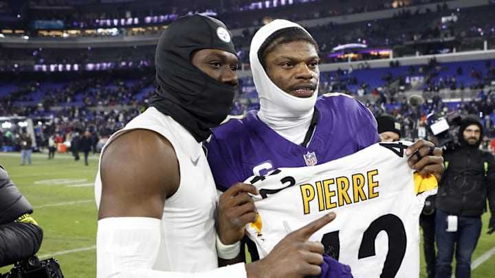 James Pierre (left) got the better of cousin Lamar Jackson (right) Sunday.