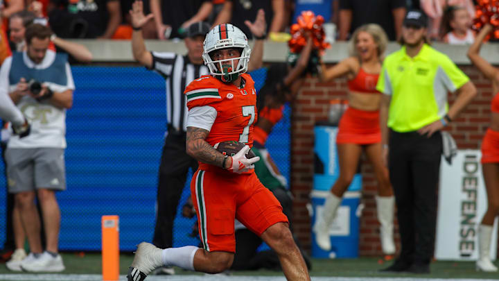 Nov 9, 2024; Atlanta, Georgia, USA; Miami Hurricanes wide receiver Xavier Restrepo (7) catches a pass for a touchdown against the Georgia Tech Yellow Jackets in the fourth quarter at Bobby Dodd Stadium at Hyundai Field. Mandatory Credit: Brett Davis-Imagn Images