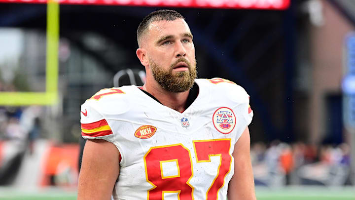 Dec 17, 2023; Foxborough, Massachusetts, USA; Kansas City Chiefs tight end Travis Kelce (87) watches from the sideline during the second half against the New England Patriots at Gillette Stadium. Mandatory Credit: Eric Canha-Imagn Images