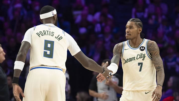 Dec 21, 2025; Minneapolis, Minnesota, USA; Milwaukee Bucks guard Kevin Porter Jr. (7) celebrates with Milwaukee Bucks forward Bobby Portis (9) after making a shot against the Minnesota Timberwolves in the second half at Target Center. Mandatory Credit: Jesse Johnson-Imagn Images