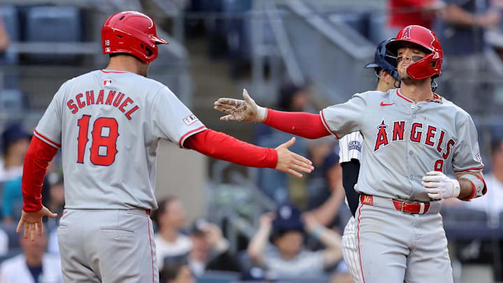 Aug 7, 2024; Bronx, New York, USA; Los Angeles Angels shortstop Zach Neto (9) celebrates his two run home run against the New York Yankees with first baseman Nolan Schanuel (18) during the seventh inning at Yankee Stadium. Mandatory Credit: Brad Penner-Imagn Images