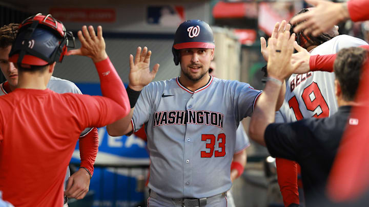 Jun 27, 2025; Anaheim, California, USA; Washington Nationals first baseman Nathaniel Lowe (33) is greeted in the dugout after scoring a run during the fifth inning against the Los Angeles Angels at Angel Stadium. Mandatory Credit: Kiyoshi Mio-Imagn Images Jun 27, 2025; Anaheim, California, USA; Washington Nationals first baseman Nathaniel Lowe (33) is greeted in the dugout after scoring a run during the fifth inning against the Los Angeles Angels at Angel Stadium. Mandatory Credit: Kiyoshi Mio-Imagn Images