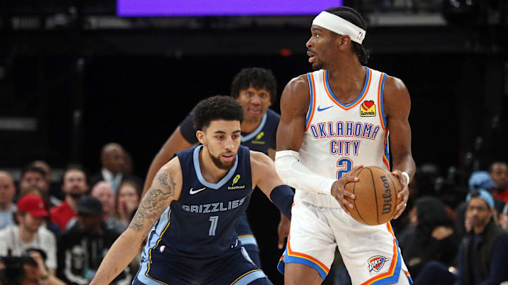 Mar 5, 2025; Memphis, Tennessee, USA; Oklahoma City Thunder guard Shai Gilgeous-Alexander (2) handles the ball as Memphis Grizzlies guard Scotty Pippen Jr. (1) defends during the third quarter at FedExForum. Mandatory Credit: Petre Thomas-Imagn Images Mar 5, 2025; Memphis, Tennessee, USA; Oklahoma City Thunder guard Shai Gilgeous-Alexander (2) handles the ball as Memphis Grizzlies guard Scotty Pippen Jr. (1) defends during the third quarter at FedExForum. Mandatory Credit: Petre Thomas-Imagn Images
