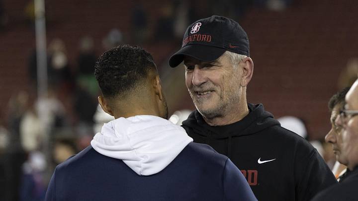 Nov 29, 2025; Stanford, California, USA;  Stanford Cardinal head coach Frank Reich (right) speaks with Notre Dame Fighting Irish head coach Marcus Freeman after the game at Stanford Stadium. Mandatory Credit: Stan Szeto-Imagn Images
