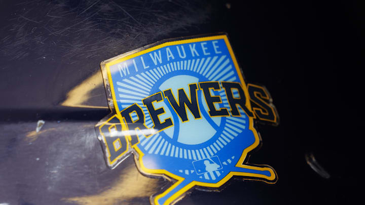 Jun 18, 2023; Milwaukee, Wisconsin, USA;  A Milwaukee Brewers logo on a batting helmet in the dugout prior to the game against the Pittsburgh Pirates at American Family Field. Mandatory Credit: Jeff Hanisch-Imagn Images