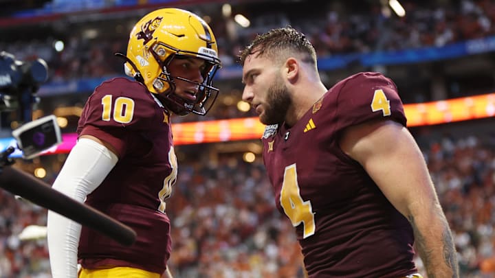 Jan 1, 2025; Atlanta, GA, USA; Arizona State Sun Devils running back Cam Skattebo (4) celebrates with quarterback Sam Leavitt (10) after scoring a touchdown against the Texas Longhorns during the second half of the Peach Bowl at Mercedes-Benz Stadium. Mandatory Credit: Brett Davis-Imagn Images Jan 1, 2025; Atlanta, GA, USA; Arizona State Sun Devils running back Cam Skattebo (4) celebrates with quarterback Sam Leavitt (10) after scoring a touchdown against the Texas Longhorns during the second half of the Peach Bowl at Mercedes-Benz Stadium. Mandatory Credit: Brett Davis-Imagn Images