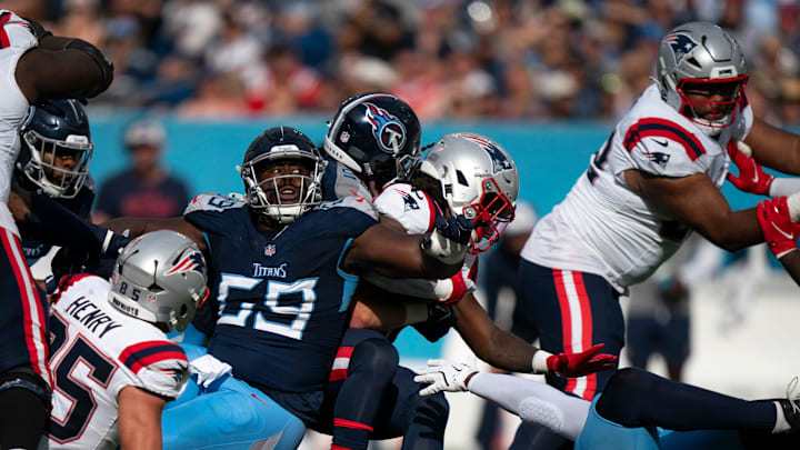 Tennessee Titans defensive tackle Sebastian Joseph-Day (69) is in on the tackle of New England Patriots running back Rhamondre Stevenson (38) during their game at Nissan Stadium in Nashville, Tenn., Sunday, Nov. 3, 2024.