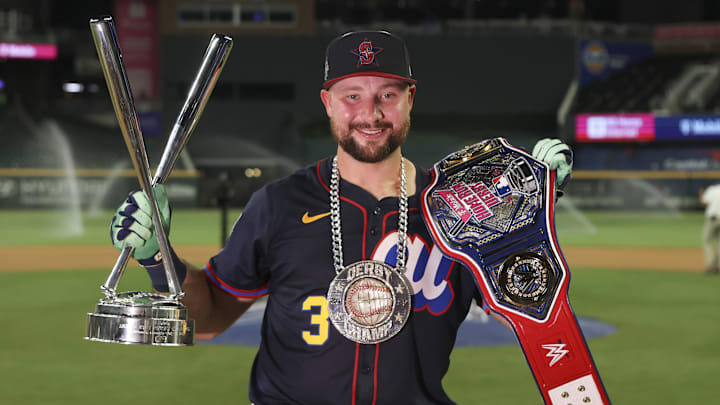Seattle Mariners catcher Cal Raleigh (29) holds the trophy after winning the 2025 Home Run Derby at Truist Park on July 14.