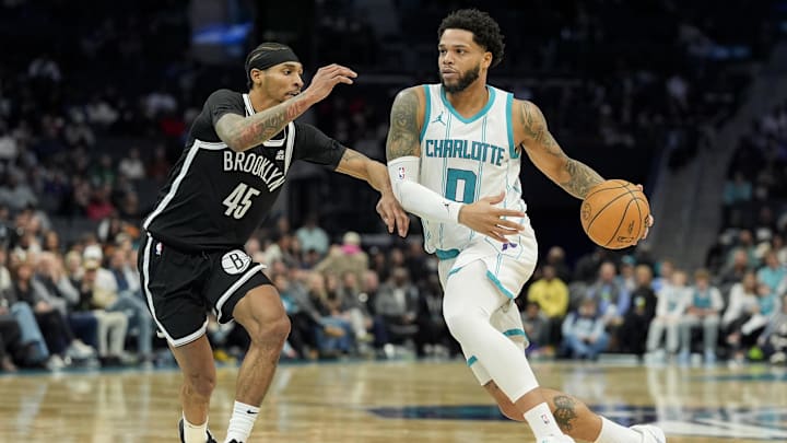 Charlotte Hornets forward Miles Bridges drives to the basket against Brooklyn Nets guard Keon Johnson during the second half at Spectrum Center. Charlotte Hornets forward Miles Bridges drives to the basket against Brooklyn Nets guard Keon Johnson during the second half at Spectrum Center.