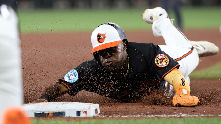 Jul 28, 2025; Baltimore, Maryland, USA; Baltimore Orioles outfielder Cedric Mullins (31) slides into third base safely during the sixth inning against the Toronto Blue Jays at Oriole Park at Camden Yards. Mandatory Credit: Daniel Kucin Jr.-Imagn Images