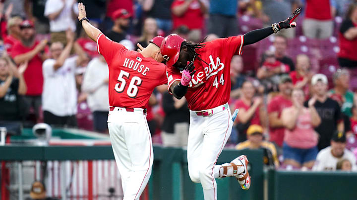 Cincinnati Reds shortstop Elly De La Cruz (44) and Cincinnati Reds third base coach J.R. House (56) dab after Cruz hits a two-run homer in the second inning of a MLB game between the Cincinnati Reds and Pittsburgh Pirates, Tuesday, Sept. 23, 2025, at Great American Ball Park in downtown Cincinnati. Cincinnati Reds shortstop Elly De La Cruz (44) and Cincinnati Reds third base coach J.R. House (56) dab after Cruz hits a two-run homer in the second inning of a MLB game between the Cincinnati Reds and Pittsburgh Pirates, Tuesday, Sept. 23, 2025, at Great American Ball Park in downtown Cincinnati.