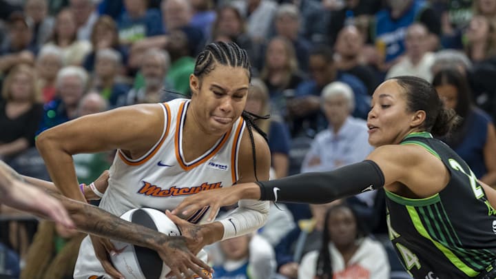 Jun 3, 2025; Minneapolis, Minnesota, USA; Phoenix Mercury forward Satou Sabally (0) drives to the basket past Minnesota Lynx forward Napheesa Collier (24) in the second half at Target Center. Mandatory Credit: Jesse Johnson-Imagn Images