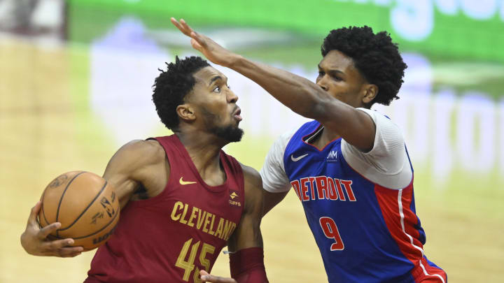 Jan 31, 2024; Cleveland, Ohio, USA; Cleveland Cavaliers guard Donovan Mitchell (45) drives against Detroit Pistons forward Ausar Thompson (9) in the first quarter at Rocket Mortgage FieldHouse. Mandatory Credit: David Richard-USA TODAY Sports