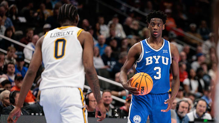 Mar 11, 2026; Kansas City, MO, USA; BYU Cougars forward AJ Dybantsa (3) sets the play in front of West Virginia Mountaineers forward Brenen Lorient (0) during the second half at T-Mobile Center. Mandatory Credit: William Purnell-Imagn Images