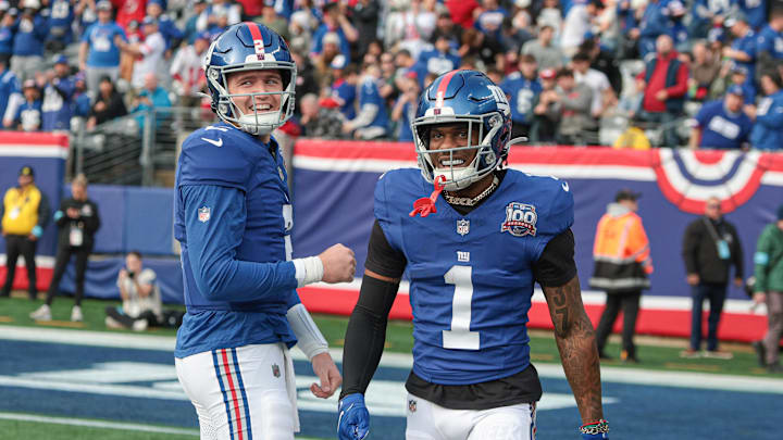 Dec 29, 2024; East Rutherford, New Jersey, USA; New York Giants wide receiver Malik Nabers (1) celebrates with quarterback Drew Lock (2) after a touchdown reception during the first half against the Indianapolis Colts at MetLife Stadium. Mandatory Credit: Vincent Carchietta-Imagn Images
