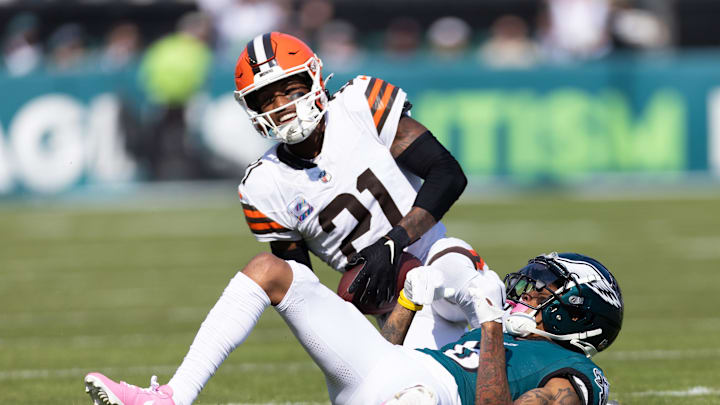 Oct 13, 2024; Philadelphia, Pennsylvania, USA; Cleveland Browns cornerback Denzel Ward (21) breaks up a pass to Philadelphia Eagles wide receiver DeVonta Smith (6) during the first quarter at Lincoln Financial Field. Mandatory Credit: Bill Streicher-Imagn Images