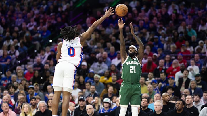 Feb 25, 2024; Philadelphia, Pennsylvania, USA; Milwaukee Bucks guard Patrick Beverley (21) scores past Philadelphia 76ers guard Tyrese Maxey (0) during the second quarter at Wells Fargo Center. Mandatory Credit: Bill Streicher-Imagn Images