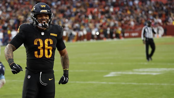 Dec 1, 2024; Landover, Maryland, USA; Washington Commanders running back Chris Rodriguez Jr. (36) celebrates after scoring a touchdown against the Tennessee Titans during the fourth quarter at Northwest Stadium. Mandatory Credit: Geoff Burke-Imagn Images