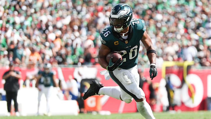 Sep 28, 2025; Tampa, Florida, USA; Philadelphia Eagles running back Saquon Barkley (26) runs with the ball during the third quarter against the Tampa Bay Buccaneers at Raymond James Stadium.  