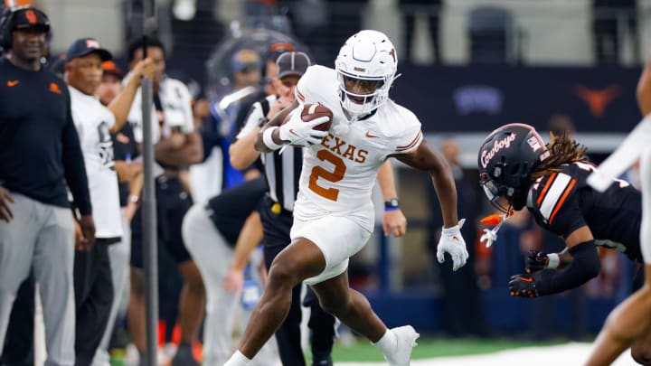 Dec 2, 2023; Arlington, TX, USA; Texas Longhorns wide receiver Johntay Cook II (2) runs after a catch against the Oklahoma State Cowboys during the fourth quarter at AT&T Stadium. Mandatory Credit: Andrew Dieb-USA TODAY Sports Dec 2, 2023; Arlington, TX, USA; Texas Longhorns wide receiver Johntay Cook II (2) runs after a catch against the Oklahoma State Cowboys during the fourth quarter at AT&T Stadium. Mandatory Credit: Andrew Dieb-USA TODAY Sports