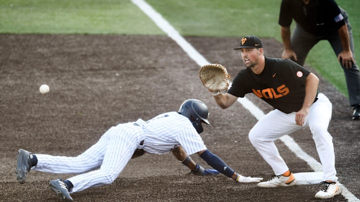 Tennessee 1st baseman Luc Lipcius (40) tries to get out Georgia Tech's Chandler Simpson during the NCAA Knoxville Regional baseball championship in Knoxville, Tenn. on Sunday, June 5, 2022.
