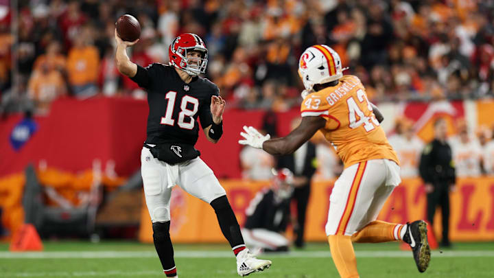 Dec 11, 2025; Tampa, Florida, USA; Atlanta Falcons quarterback Kirk Cousins (18) throws a pass against Tampa Bay Buccaneers linebacker Chris Braswell (43) during the fourth quarter at Raymond James Stadium. Mandatory Credit: Nathan Ray Seebeck-Imagn Images Dec 11, 2025; Tampa, Florida, USA; Atlanta Falcons quarterback Kirk Cousins (18) throws a pass against Tampa Bay Buccaneers linebacker Chris Braswell (43) during the fourth quarter at Raymond James Stadium. Mandatory Credit: Nathan Ray Seebeck-Imagn Images