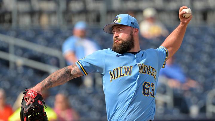 Feb 23, 2026; Peoria, Arizona, USA;  Milwaukee Brewers pitcher Drew Rom (63) delivers to the plate against the San Diego Padres at Peoria Sports Complex. Mandatory Credit: Jayne Kamin-Oncea-Imagn Images