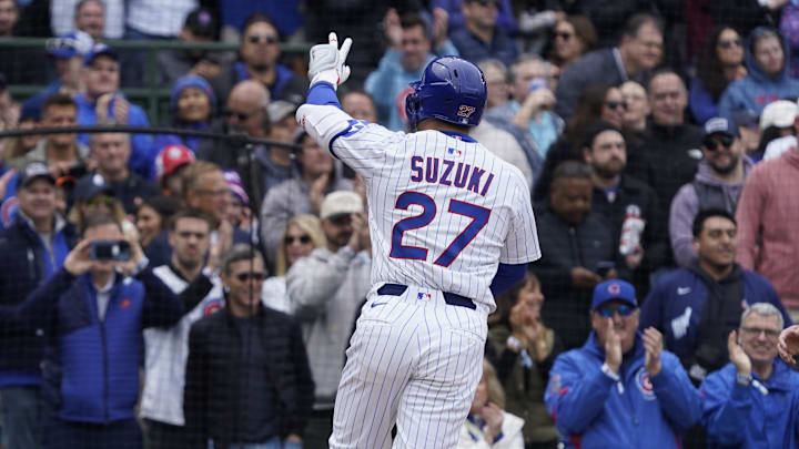 Chicago, Illinois, USA; Chicago Cubs outfielder Seiya Suzuki (27) gestures after hitting a two-run home run against the Arizona Diamondbacks during the second inning at Wrigley Field.