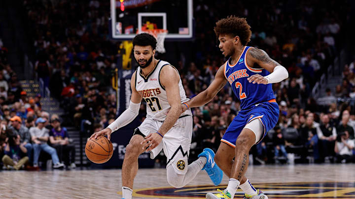 Mar 21, 2024; Denver, Colorado, USA; Denver Nuggets guard Jamal Murray (27) controls the ball as New