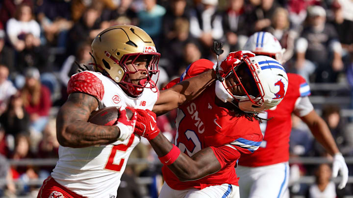 Boston College sophomore running back Turbo Richard tries to avoid an SMU player on Oct. 8. 2015 at Alumni Stadium.