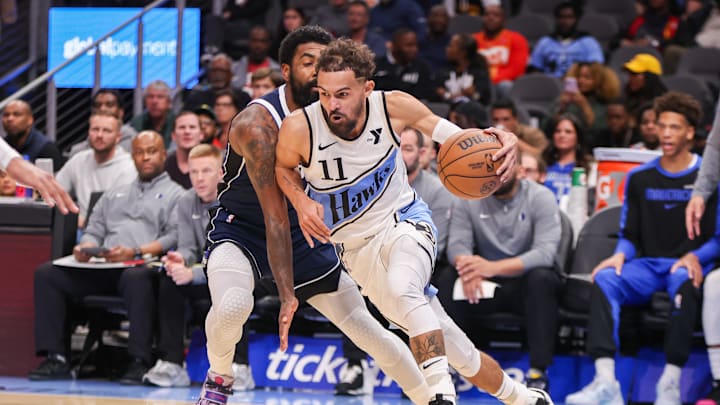 Nov 25, 2024; Atlanta, Georgia, USA; Atlanta Hawks guard Trae Young (11) drives to the basket against the Dallas Mavericks in the third quarter at State Farm Arena. Mandatory Credit: Brett Davis-Imagn Images