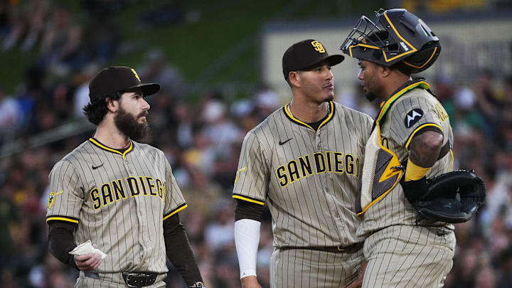 West Sacramento, California, USA; San Diego Padres catcher Martín Maldonado (15) visits the mound with third base Manny Machado (13) and pitcher Dylan Cease (84) during the first inning of the game against the Athletics at Sutter Health Park. West Sacramento, California, USA; San Diego Padres catcher Martín Maldonado (15) visits the mound with third base Manny Machado (13) and pitcher Dylan Cease (84) during the first inning of the game against the Athletics at Sutter Health Park.