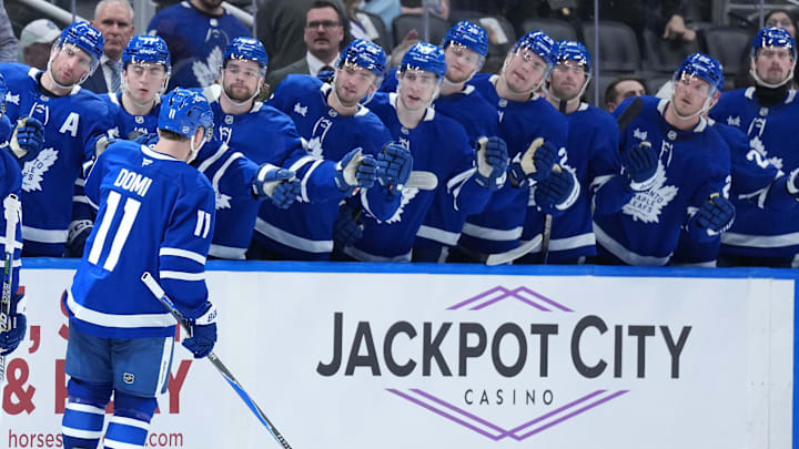 Apr 13, 2026; Toronto, Ontario, CAN; Toronto Maple Leafs center Max Domi (11) celebrates at the bench after scoring a goal against the Dallas Stars during the third period at Scotiabank Arena. Mandatory Credit: Nick Turchiaro-Imagn Images