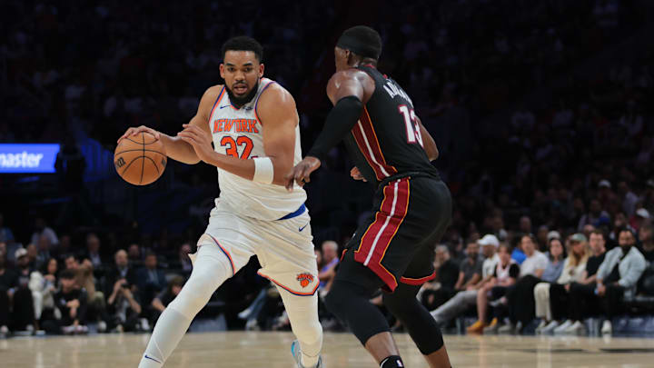 Mar 2, 2025; Miami, Florida, USA; New York Knicks center Karl-Anthony Towns (32) drives to the basket against Miami Heat center Bam Adebayo (13) during the second quarter at Kaseya Center. Mandatory Credit: Sam Navarro-Imagn Images