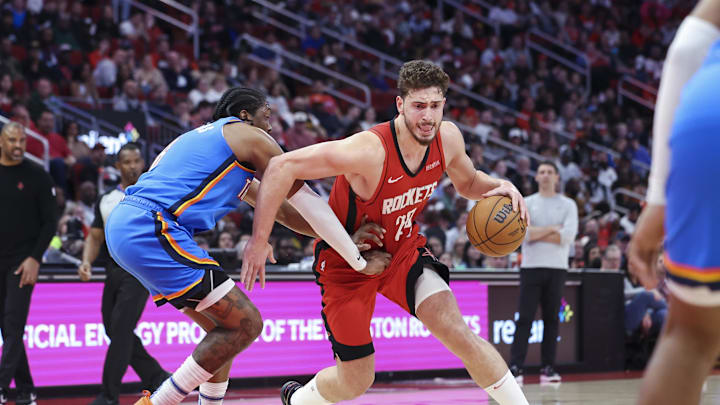Dec 1, 2024; Houston, Texas, USA; Houston Rockets center Alperen Sengun (28) drives to the basket as Oklahoma City Thunder forward Jalen Williams (8) defends during the third quarter at Toyota Center. Mandatory Credit: Troy Taormina-Imagn Images