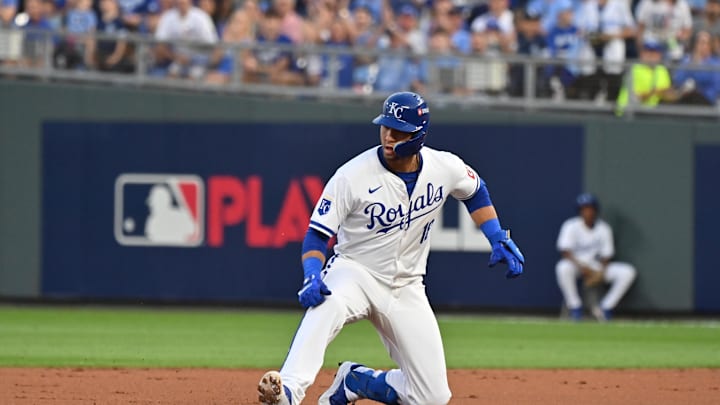 Kansas City Royals first base Yuli Gurriel (18) slides into second base against the New York Yankees  during game three of the NLDS for the 2024 MLB Playoffs at Kauffman Stadium.