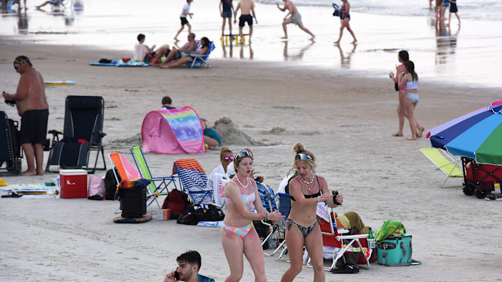 People enjoy warm temperatures during spring break at...